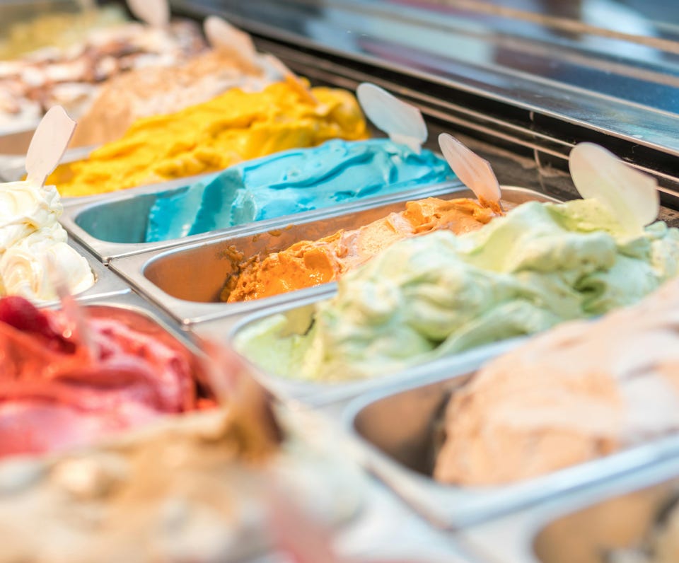Assorted-flavor Ice Cream in Display Shelf Selective Focus Photography